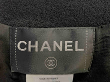 Load image into Gallery viewer, black cropped chanel jacket in black with rhinestones buttons good condition
